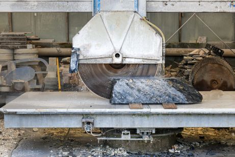 A large industrial grinding wheel in operation.